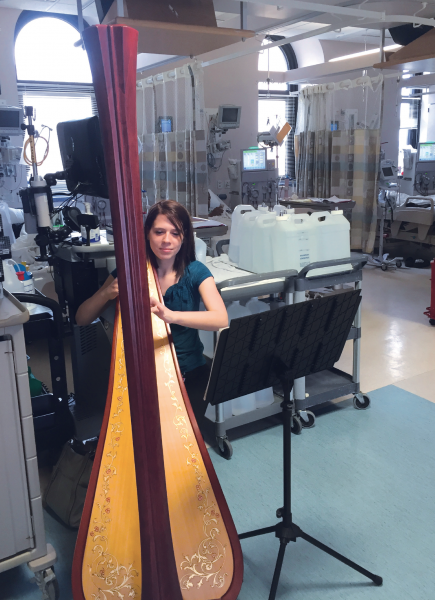 Harpist Audrey Kindsfather performs in the dialysis unit at UPMC Presbyterian.