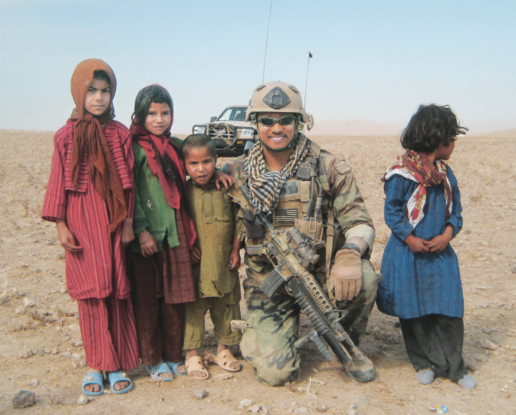 Oak bonds with children in a village near Herat.