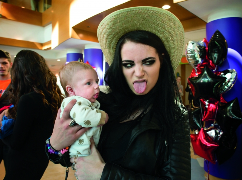 WWE’s Paige in a tongue wagging contest at Children’s Hospital.